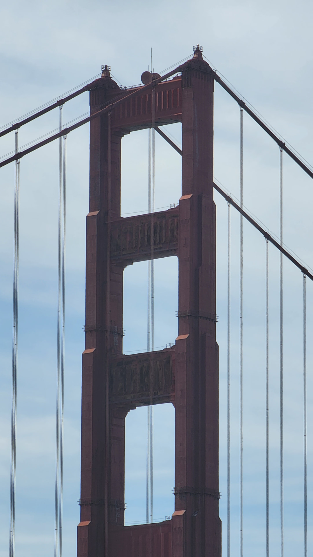 A close-up of the Golden Gate Bridge tower in San Francisco