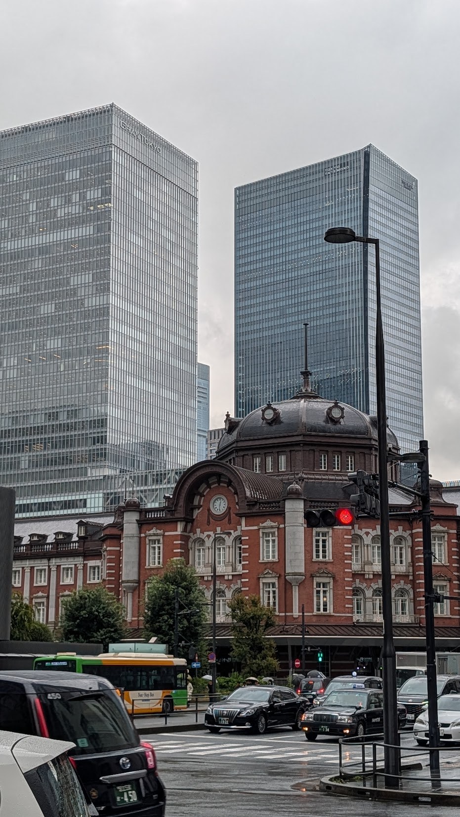 Tokyo Station’s red-brick facade against modern towers