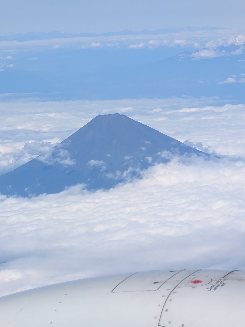Mount Fuji above the clouds from the flight home