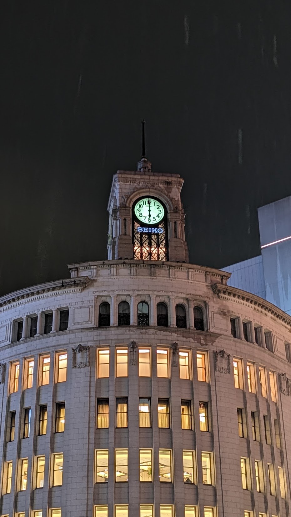 Ginza’s illuminated clock tower at night
